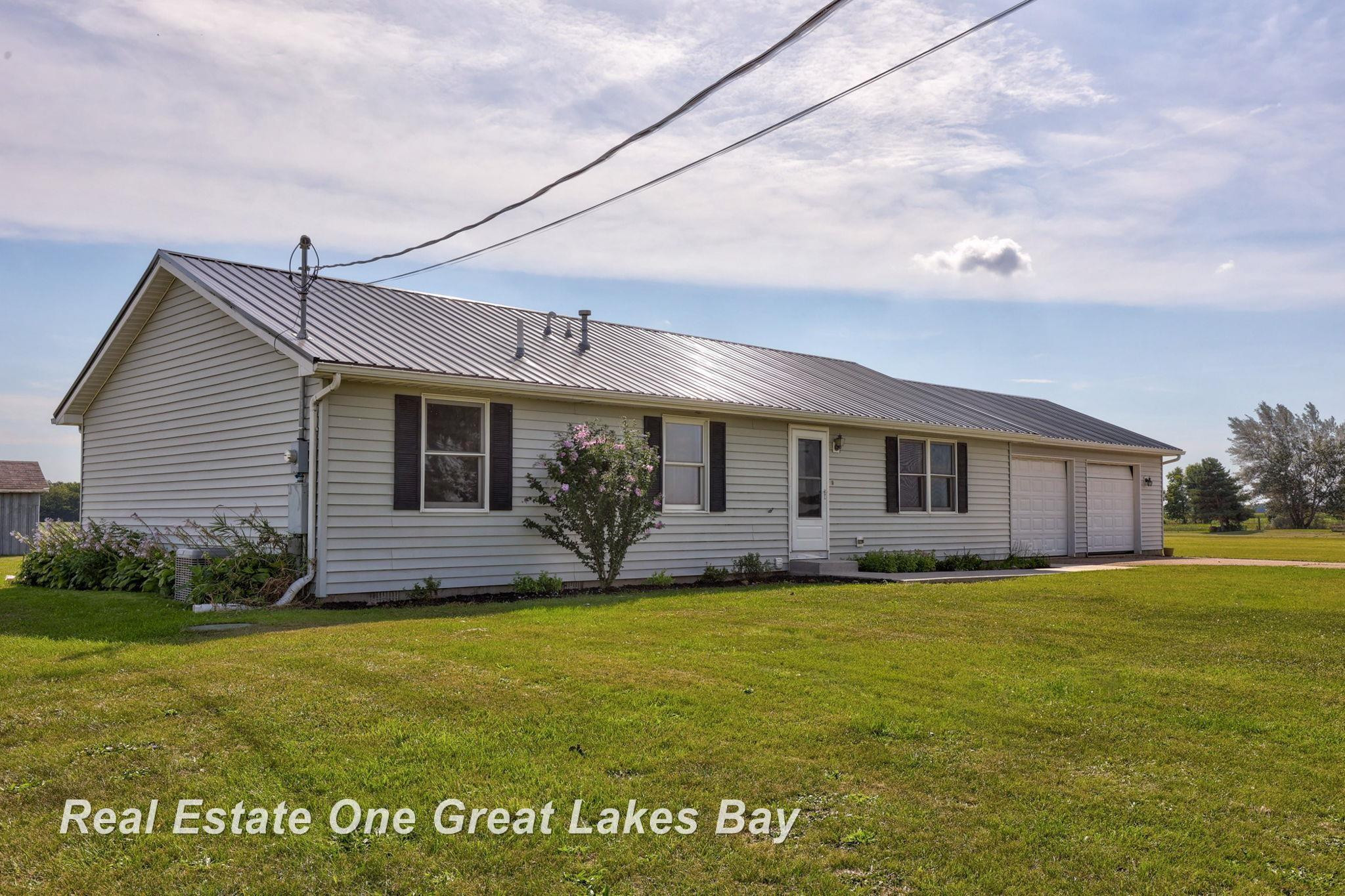 7618 N M 52 Road, Henderson, MI 48841 — front exterior