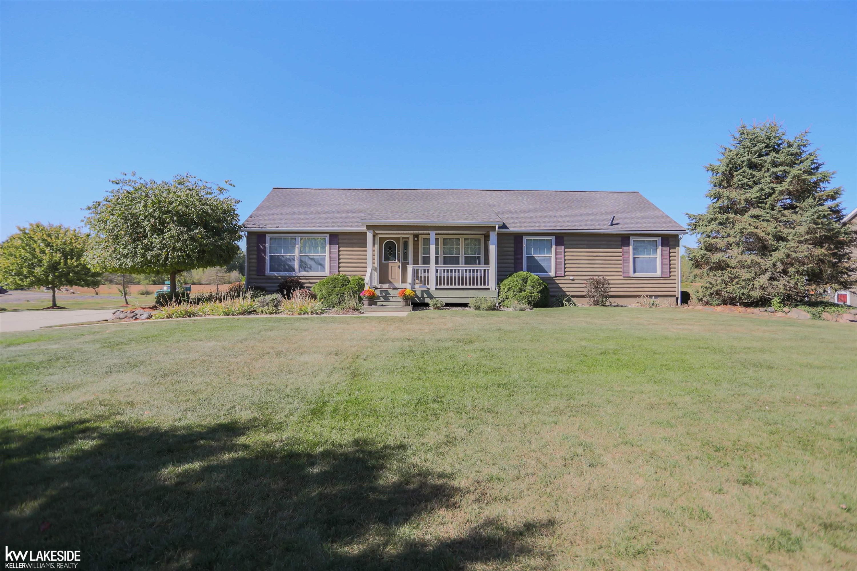70107 Wolcott Road, MI — front exterior