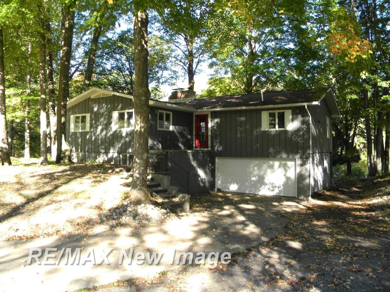 667 E Whitethorn Drive, Midland, MI 48640 — front exterior
