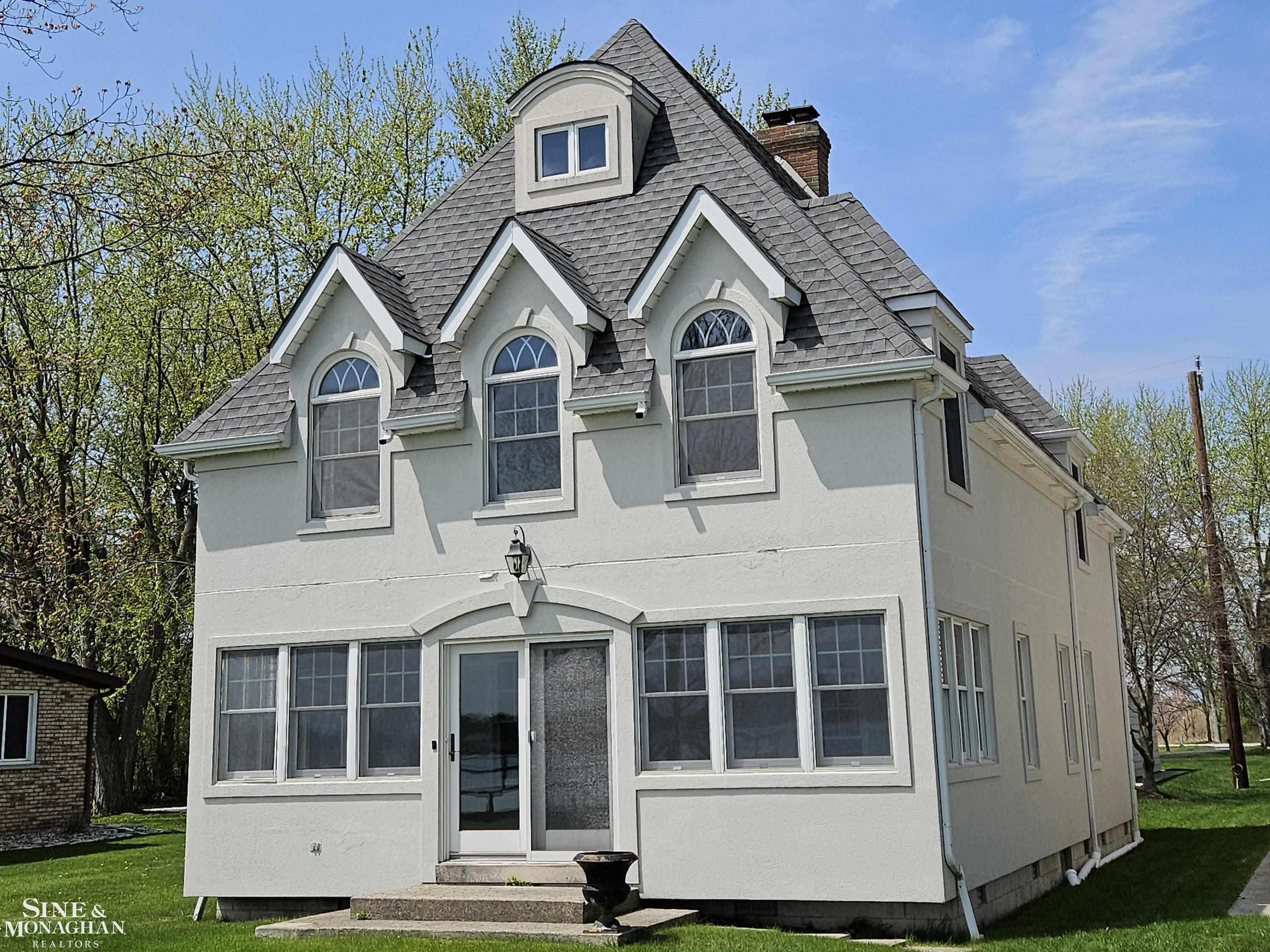 7765 S River Road, MI — front exterior