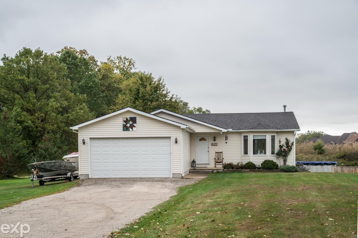 7084 Marsh Road, MI — front exterior