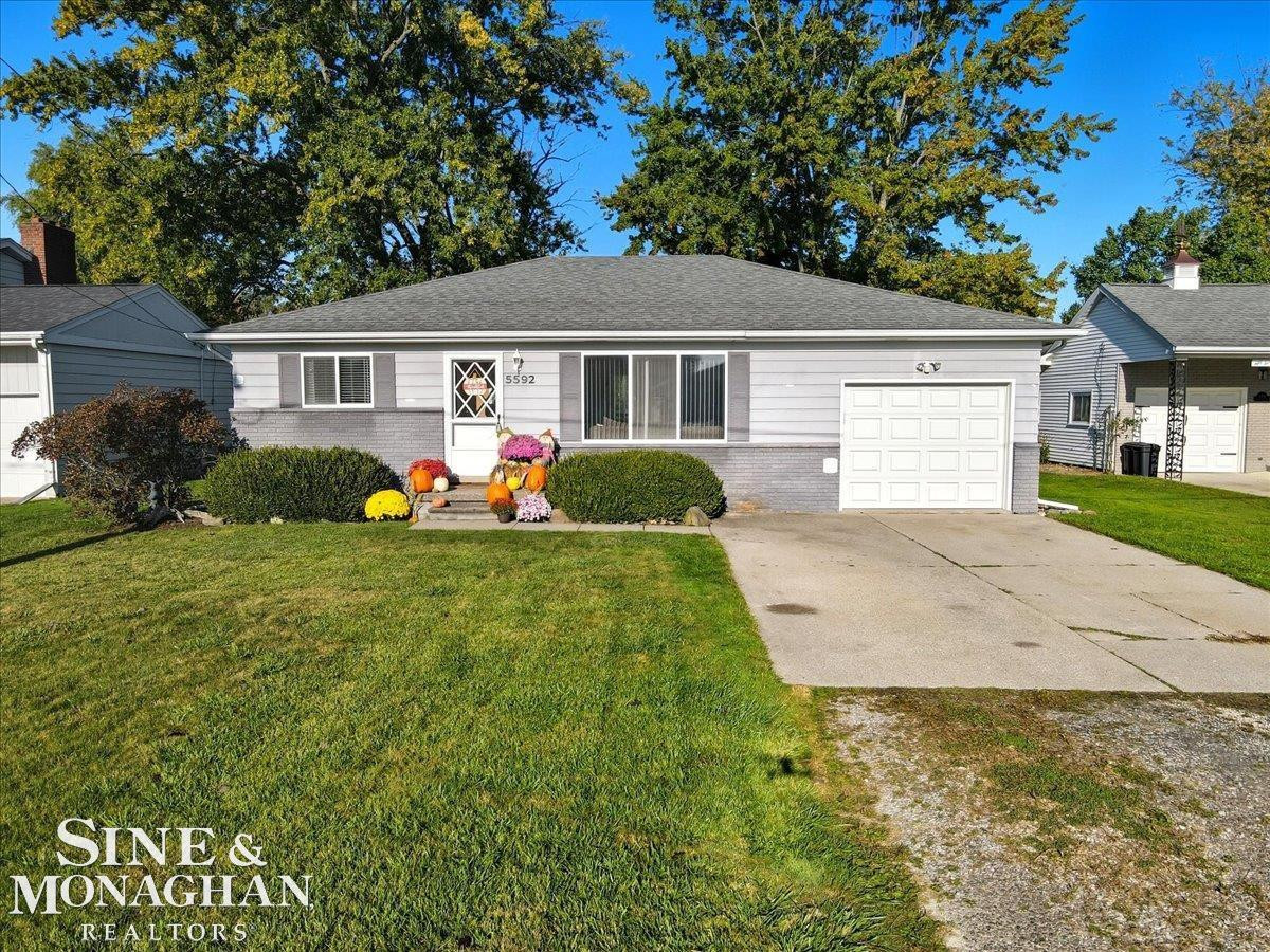 5592 Pointe Drive, MI — front exterior