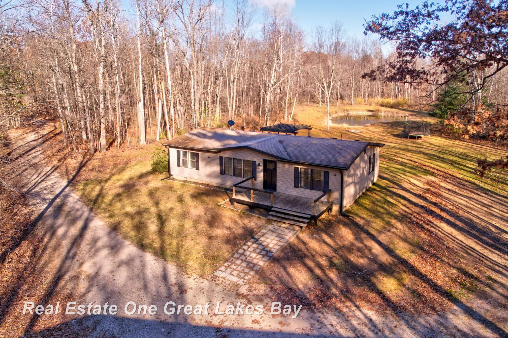 7454 N Jefferson Road, Rhodes, MI 48652 — front exterior