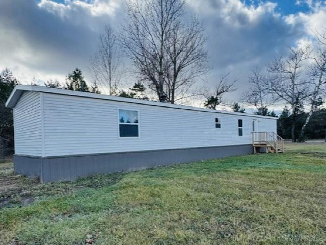 8177 Cedar River Road, Mancelona, MI 49659 — front exterior