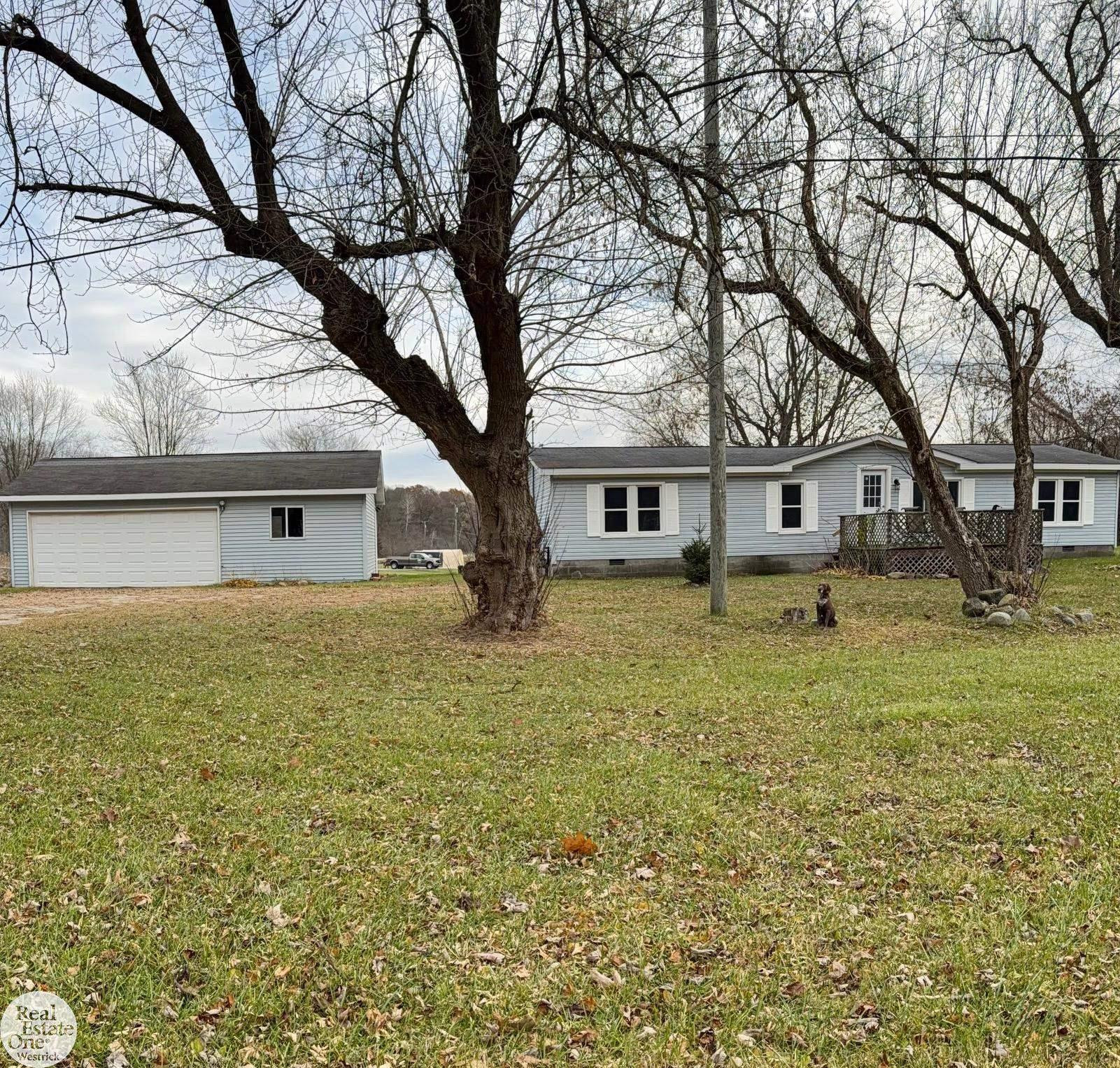 7957 Marsh Road, MI — front exterior