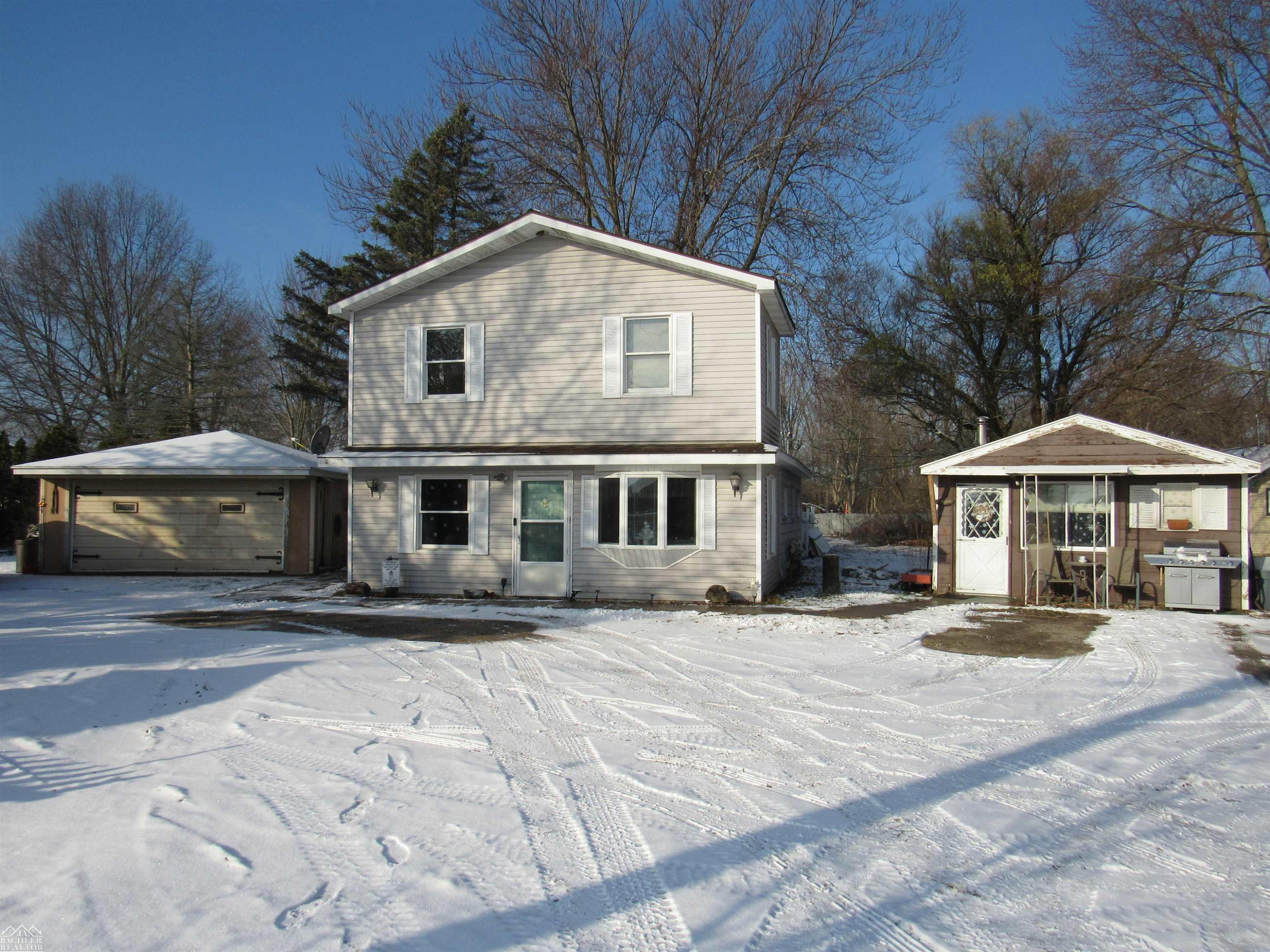 7640 River Road, MI — front exterior
