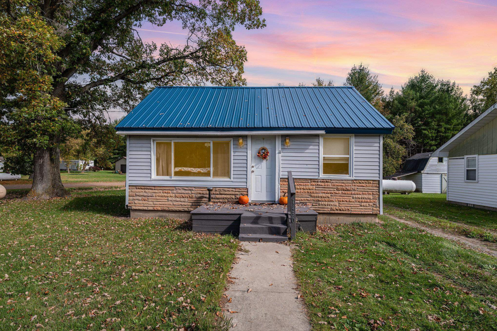 1430 Alger Court, Alger, MI 48610 — front exterior
