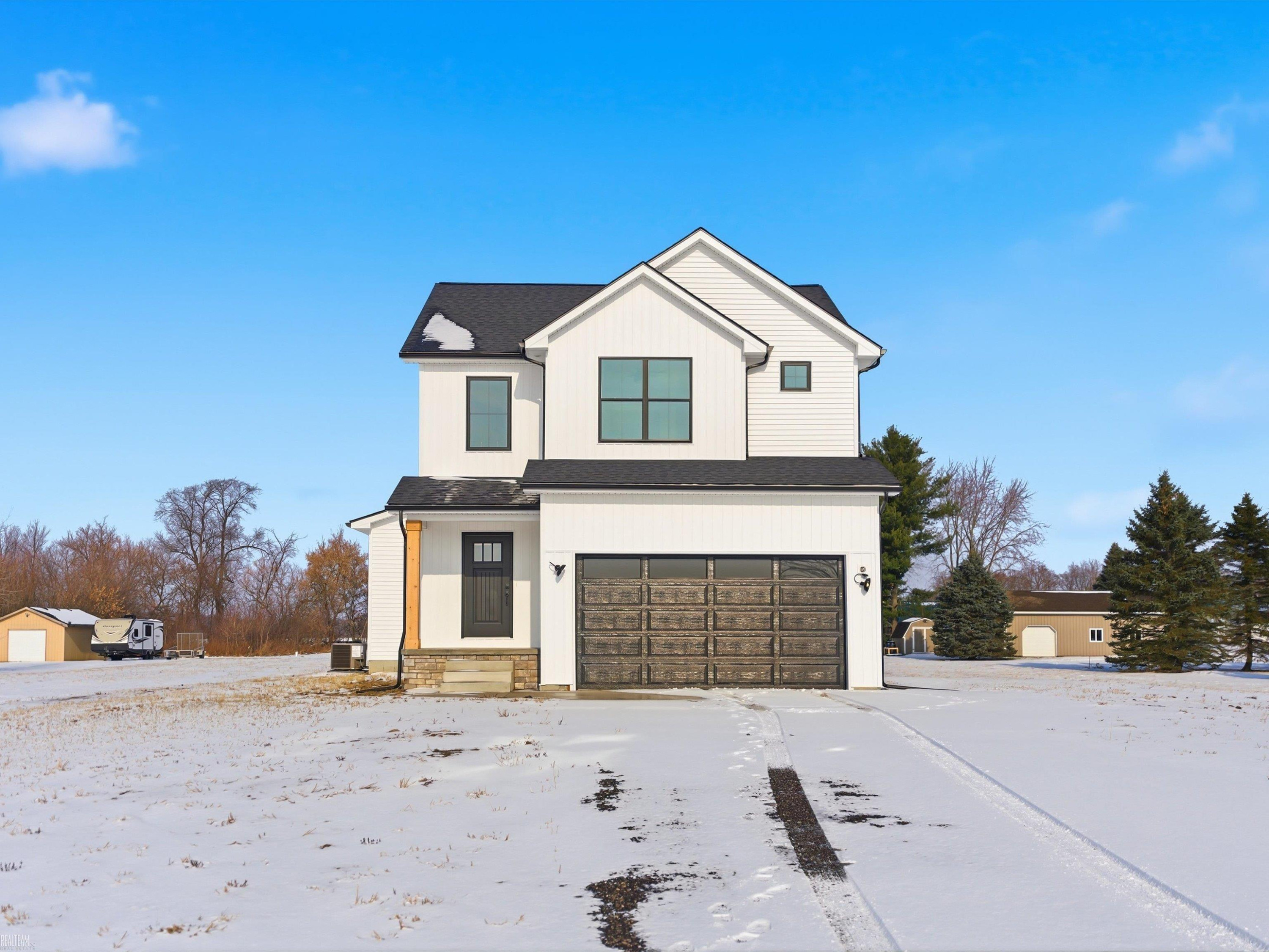 15659 Reid Road, MI — front exterior