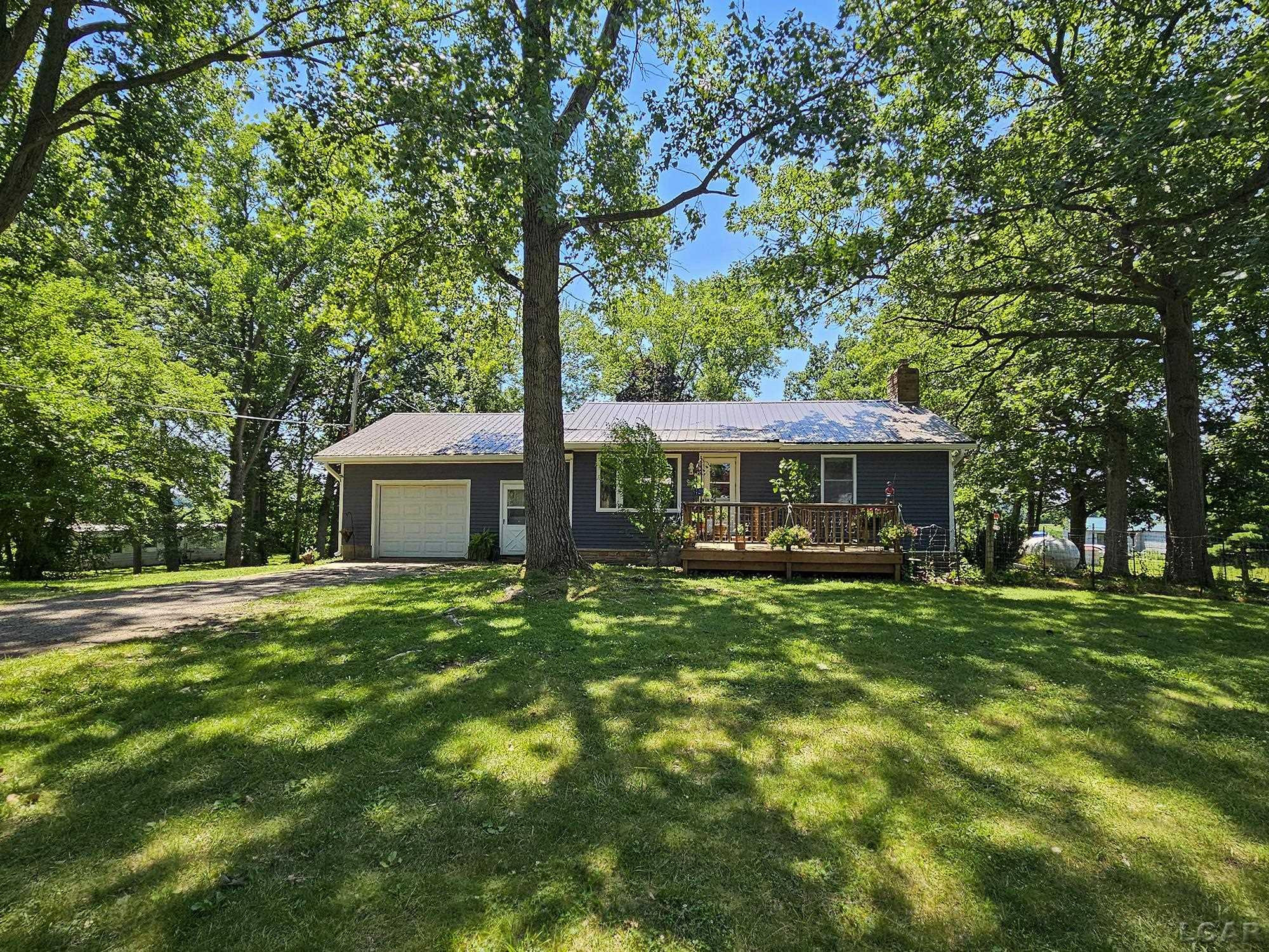 6003 Lake Road, Osseo, MI 49266 — front exterior
