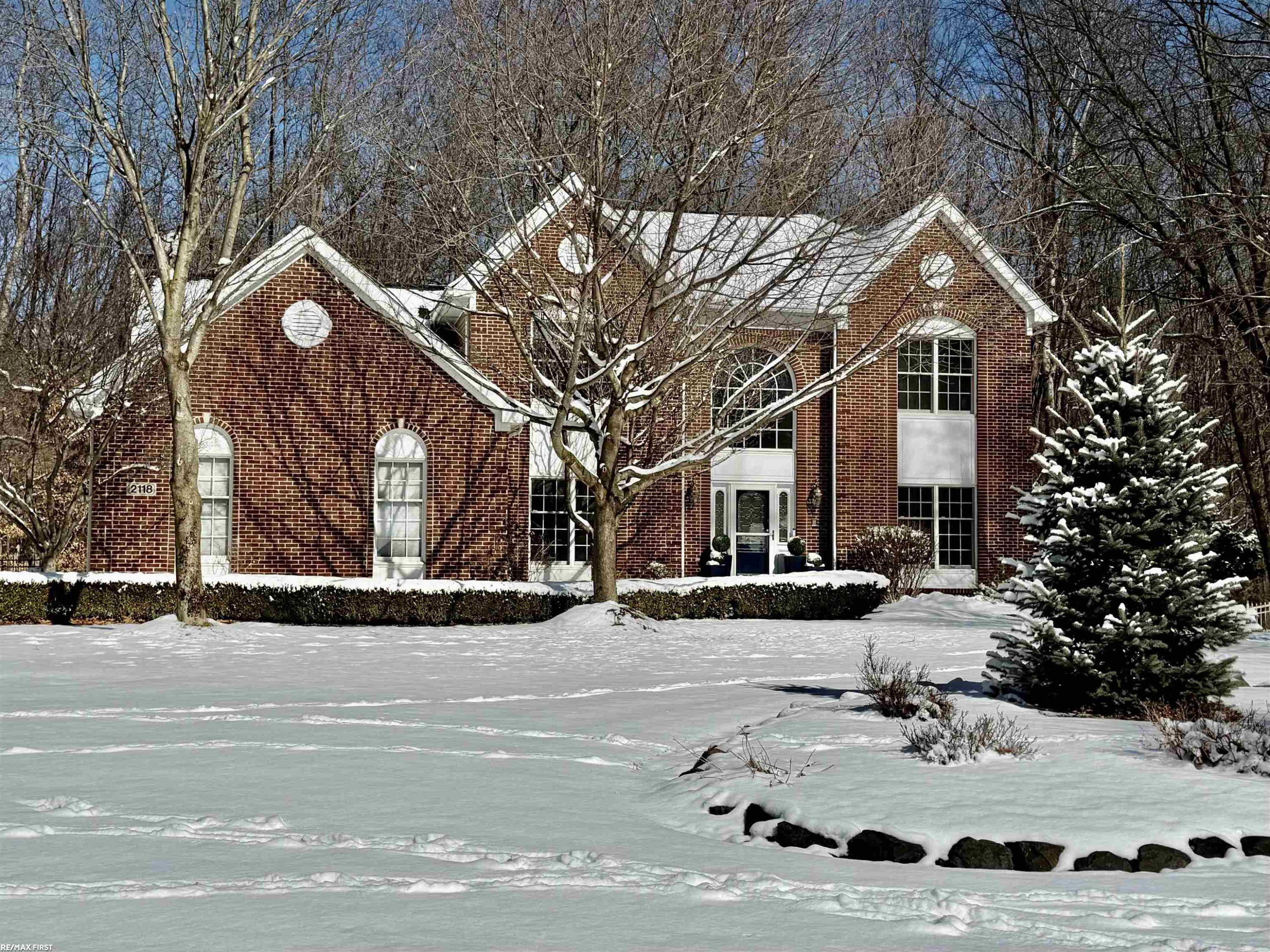 2118 Pine Bluffs Court, Highland, MI — front exterior