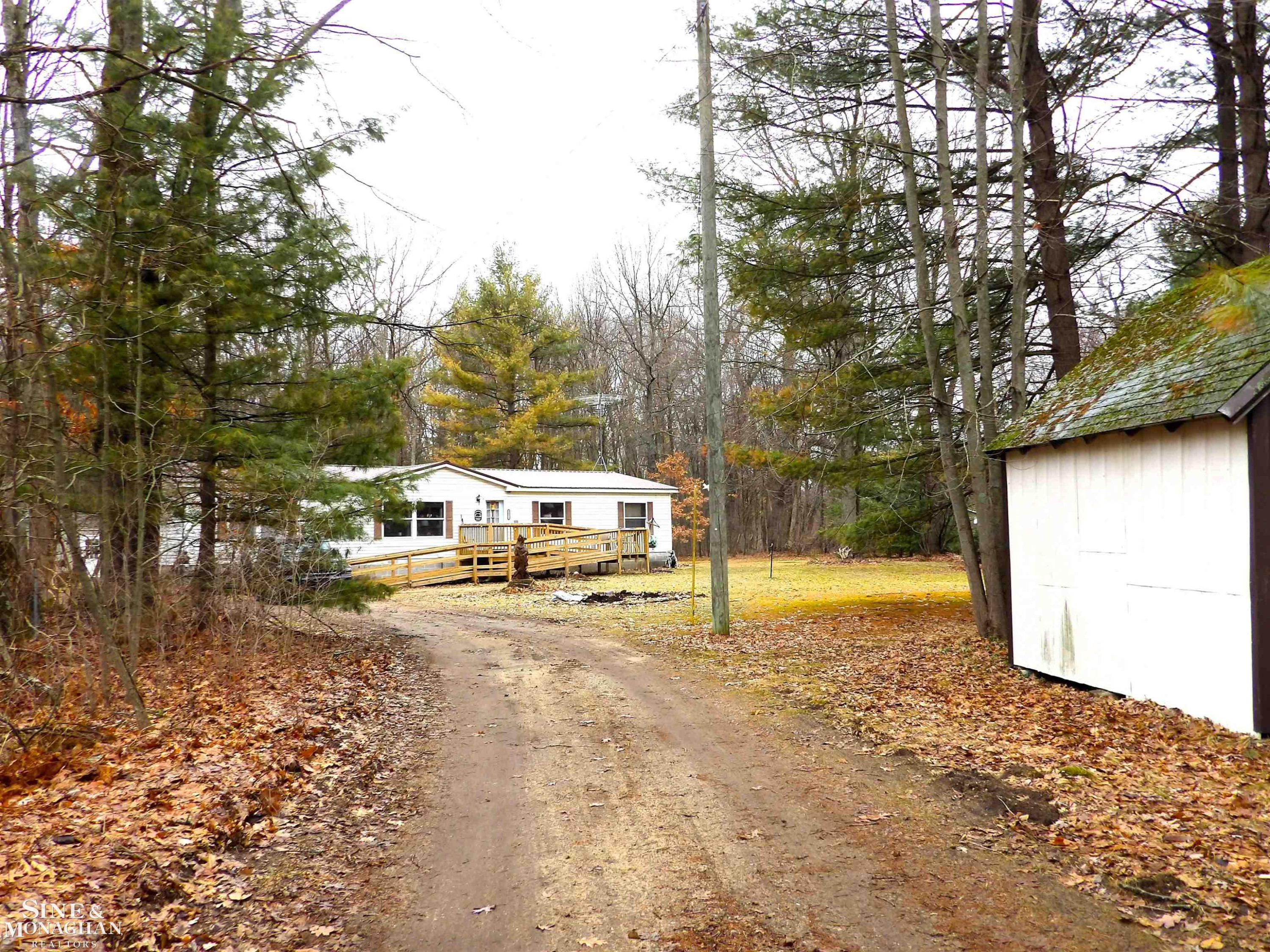 2051 W Parklane Road, White Cloud, MI 49349 — front exterior