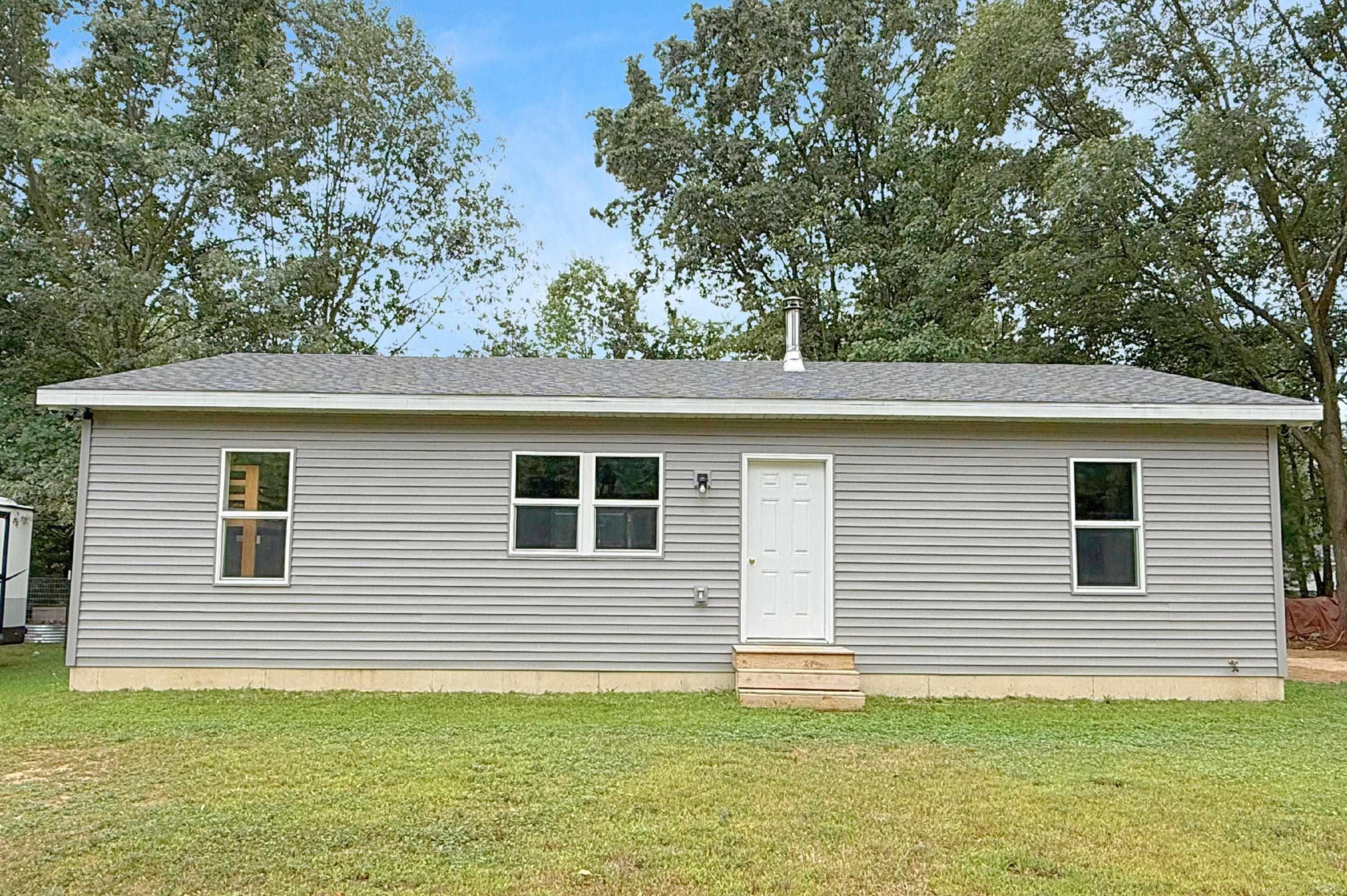8659 Wood View Drive, MI 48632 — front exterior