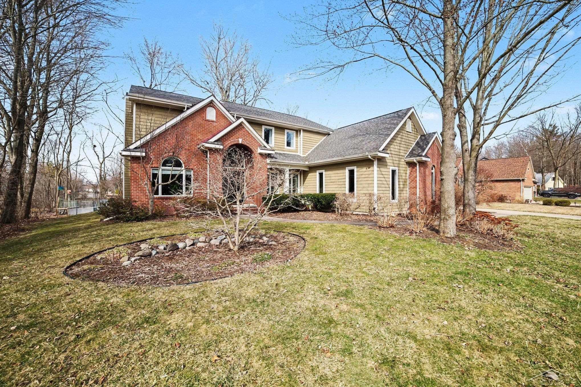 711 Honeysuckle Circle, Midland, MI 48642 — front exterior