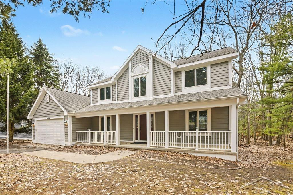3854 Village Circle Drive, Traverse City, MI 49686 — front exterior