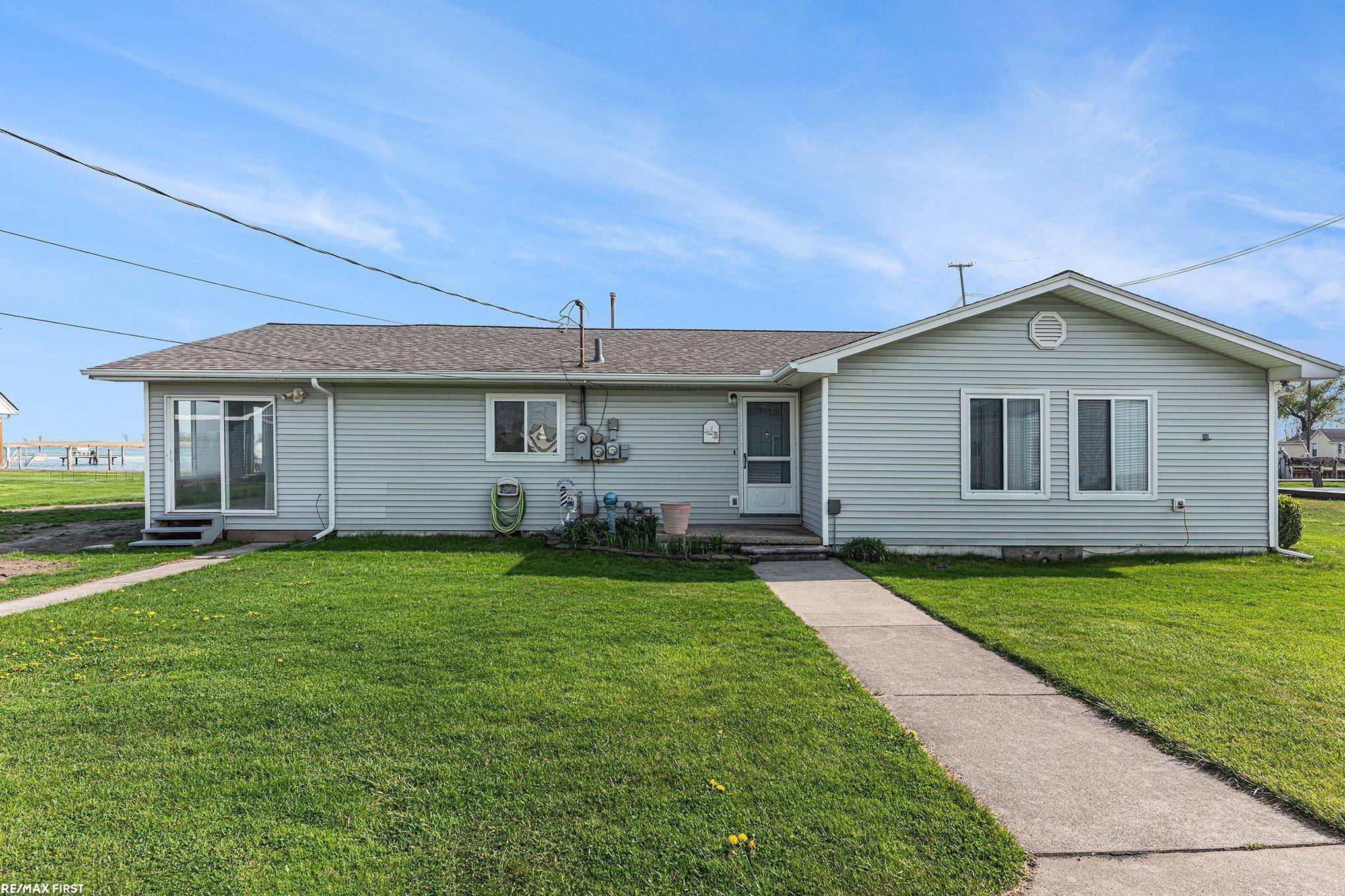 7618 South Channel Drive, MI 48028 — front exterior