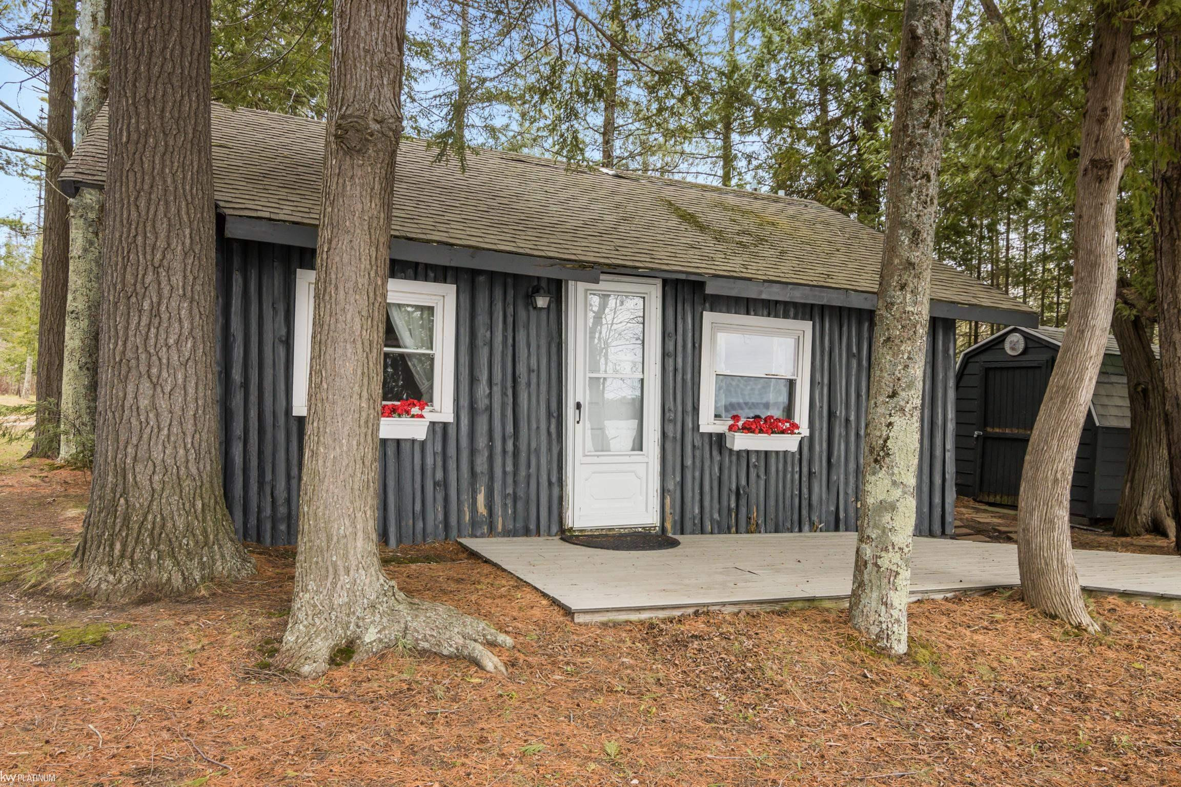 6386 Tricks Way Drive, Kewadin, MI 49648 — front exterior