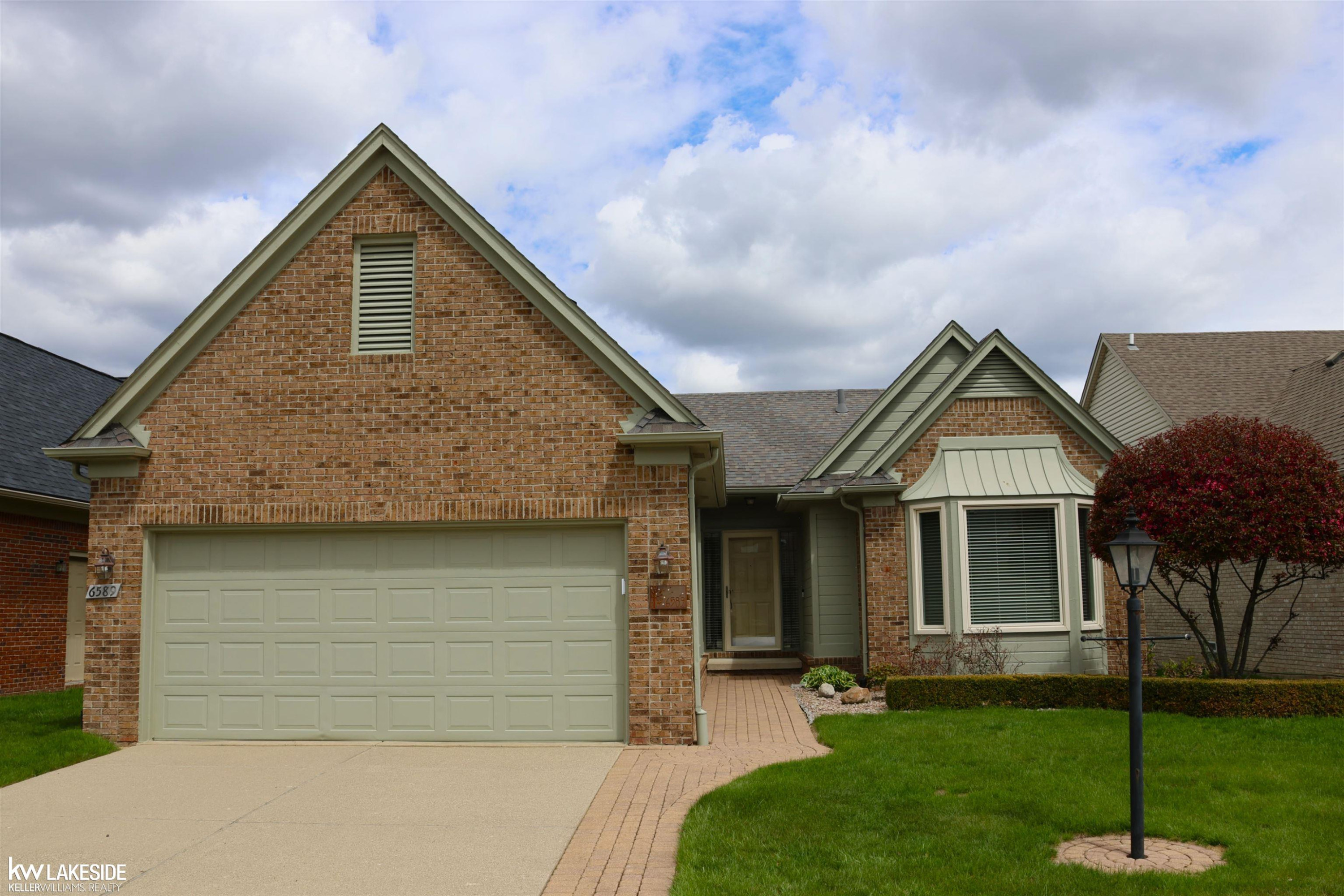 6589 Copper Creek Drive, Washington, MI — front exterior