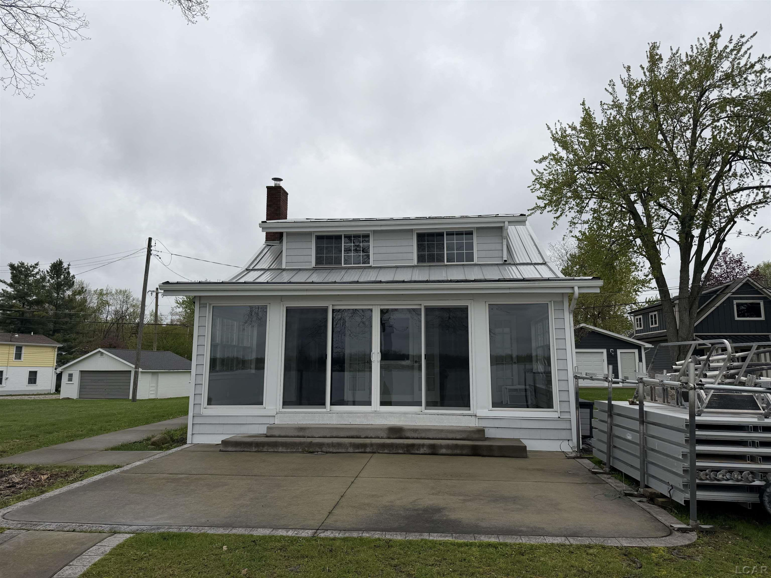 9206 Cherry Point Drive, Manitou Beach, MI 49253 — front exterior