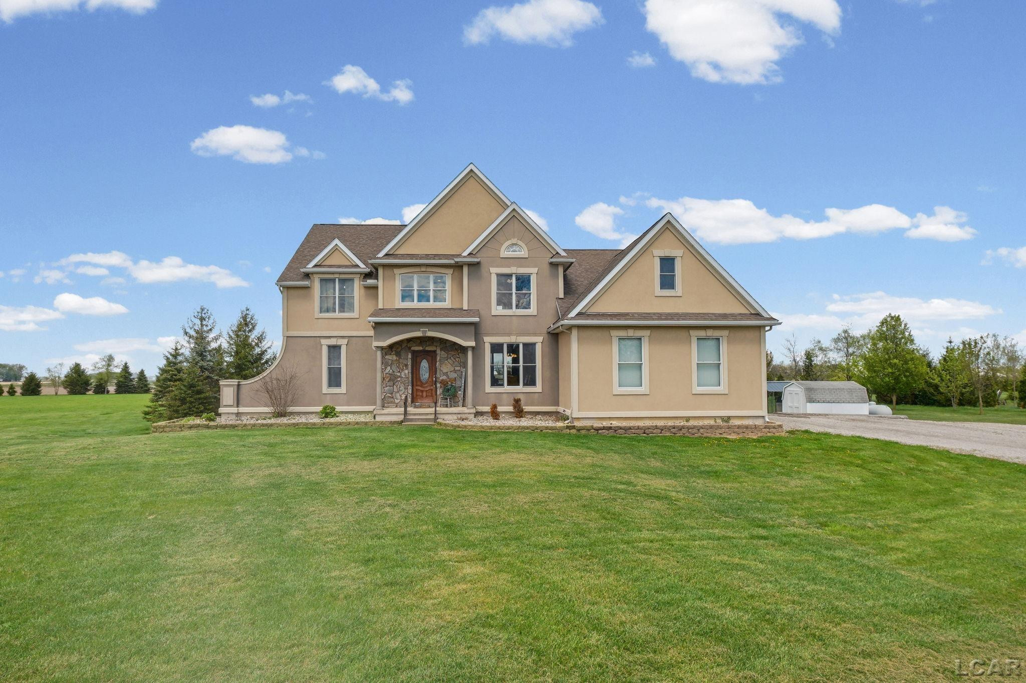 9900 Head-O-Lake Road, Riga, MI 49276 — front exterior