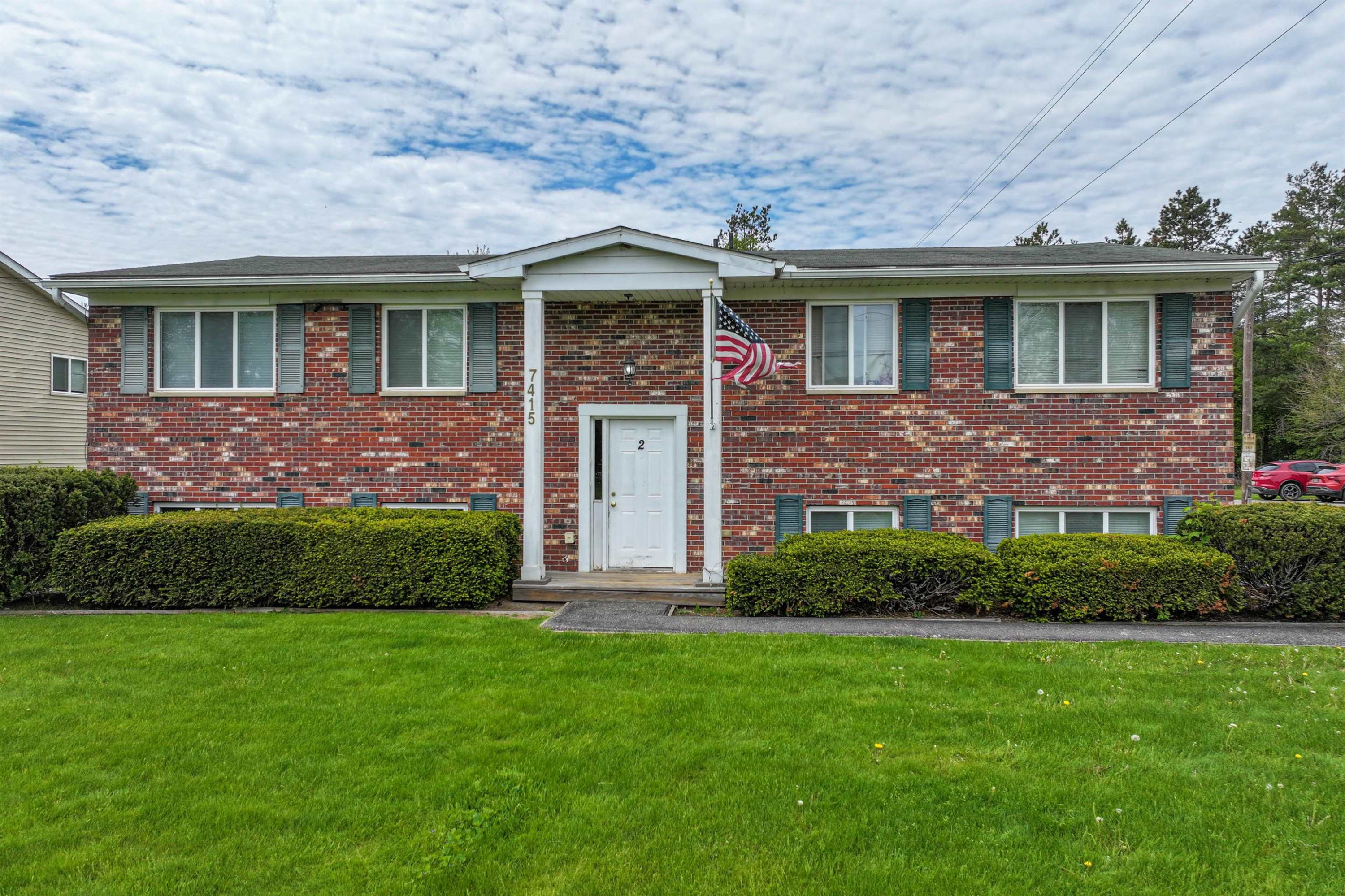 7415 Roger Thomas #2 Drive, Unit 2, MI 48458 — front exterior
