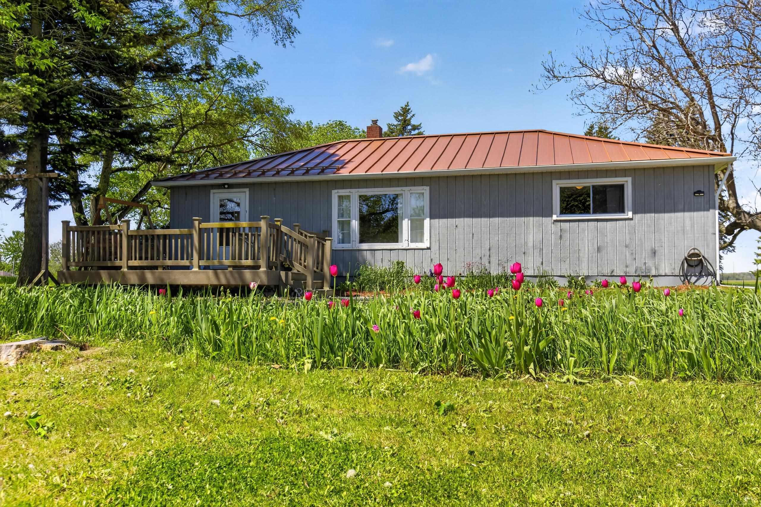 5051 5 Mile Road, Hope, MI 48628 — front exterior