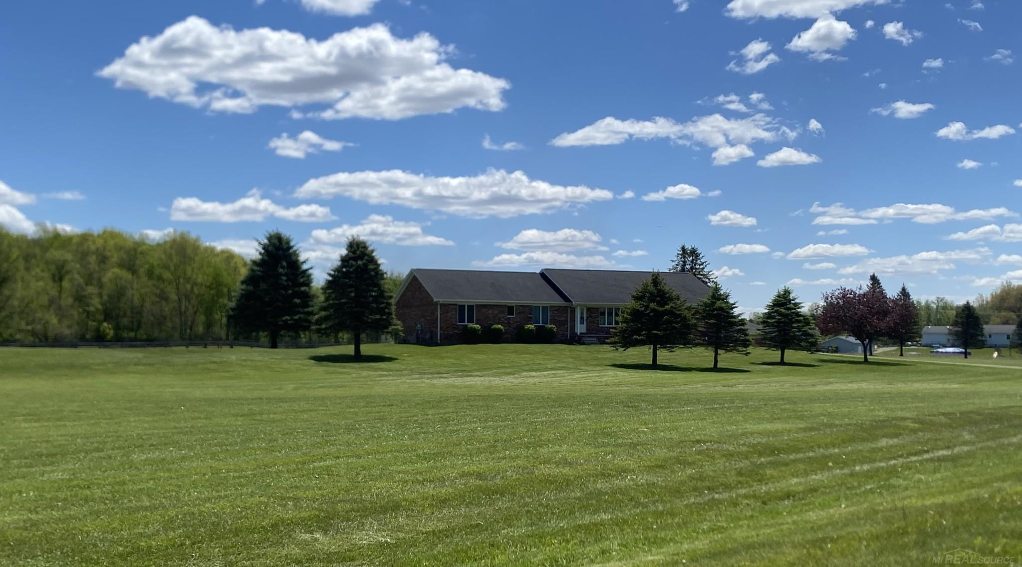 13880 Moss Creek Road, Milan, MI 48160 — front exterior