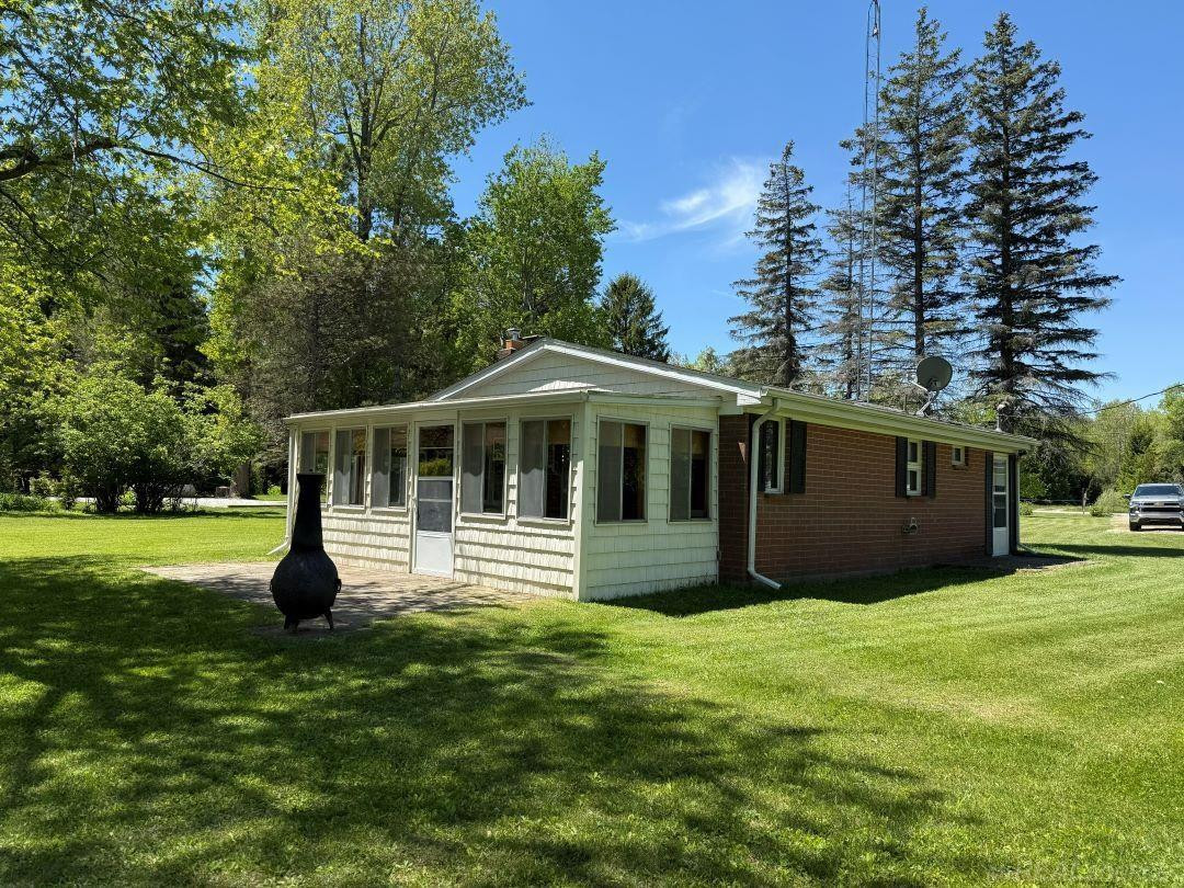 5806 N Lakeshore Road, Palms, MI 48465 — front exterior