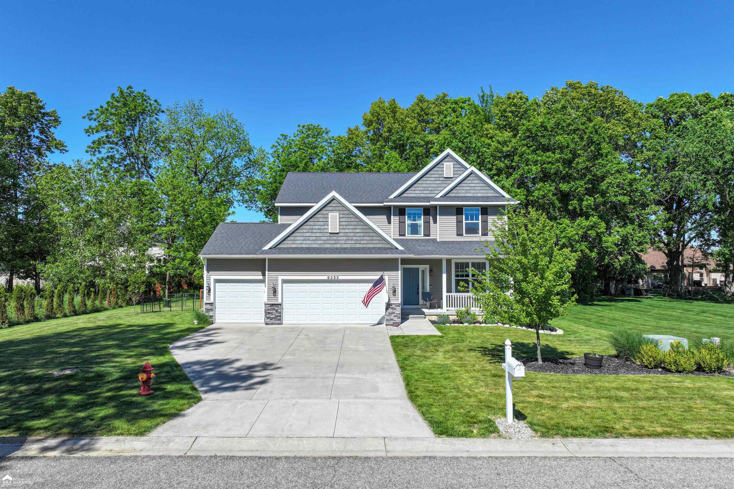 9252 Hidden Oaks Drive, Grand Blanc, MI 48439 — front exterior