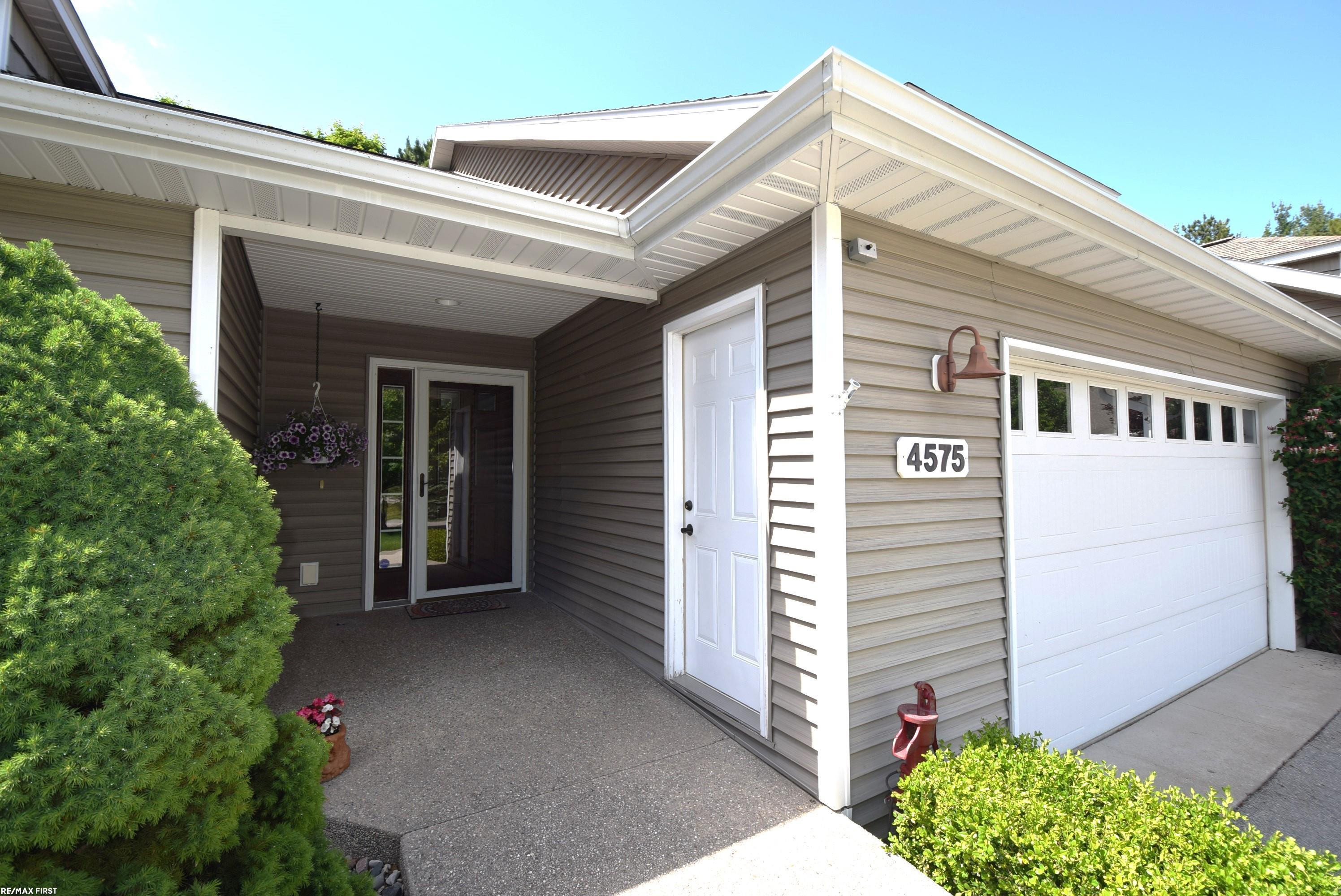 4575 Black Bear Drive, 65, Traverse City, MI 49685 — front exterior