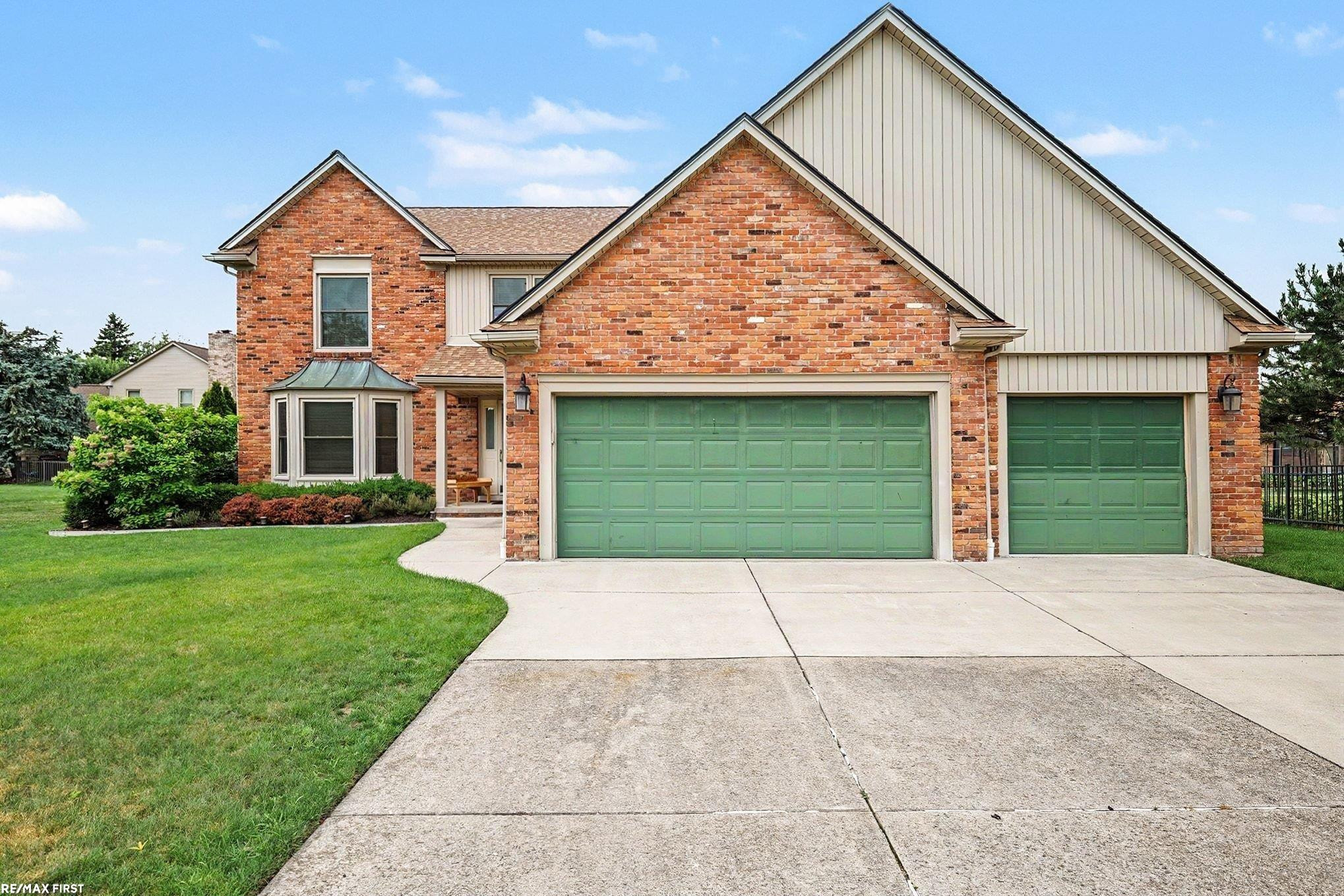 48103 Greenbriar Drive, Macomb, MI 48044 — front exterior