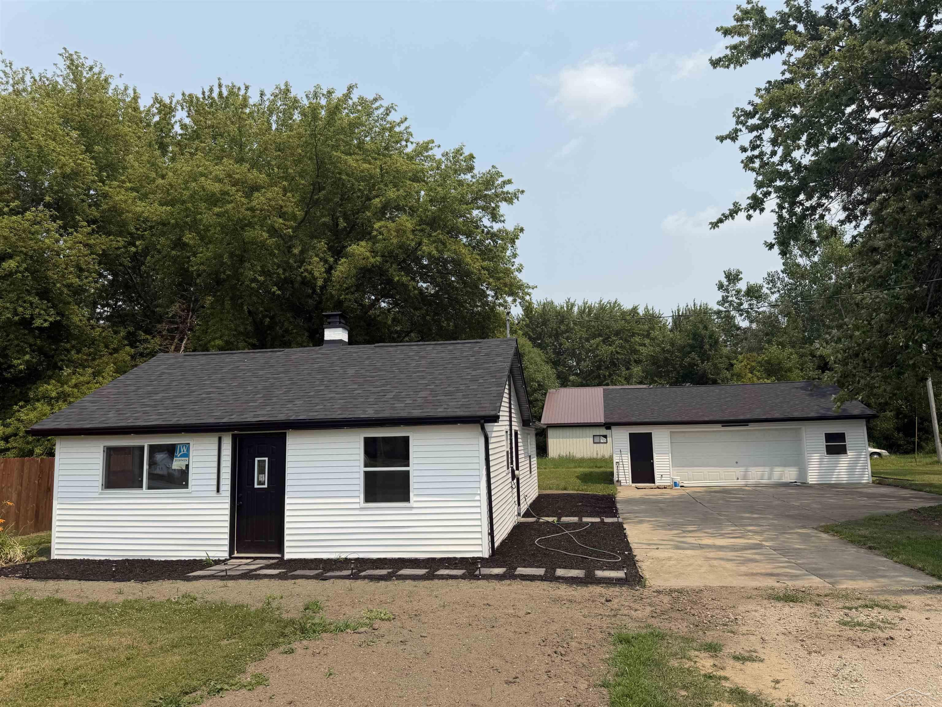 9095 East Road, Burt, MI 48417 — front exterior