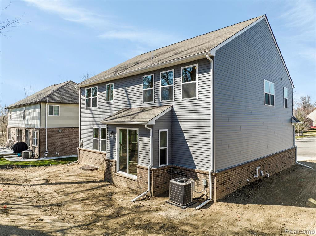 214 SINGH Boulevard, South Lyon, MI 48178 — Photo 42