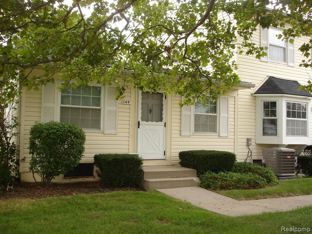 144 Lake Village Drive, APT 6, Walled Lake, MI 48390 — front exterior