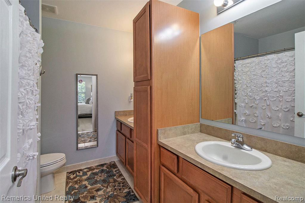 17104 CAITLIN Circle, Walled Lake, MI 48390 — Photo 12
