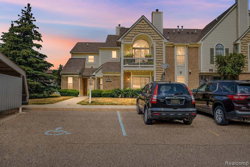 212 OAKBROOKE Drive, 2, South Lyon, MI 48178 — front exterior