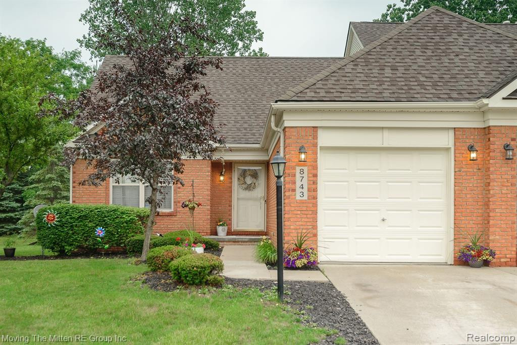 8743 HARDWOOD Drive, Unit #103, Belleville, MI 48111 — front exterior