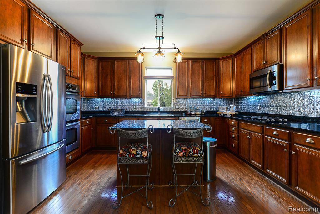 130 SINGH Boulevard, South Lyon, MI 48178 — Photo 4