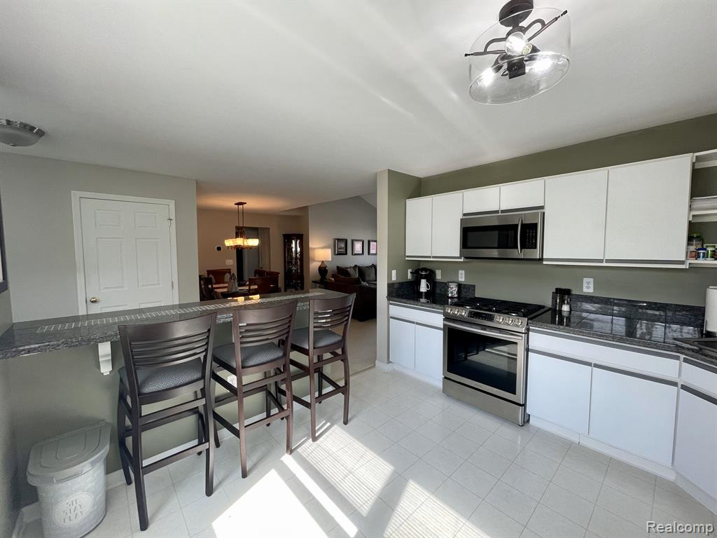 709 FIELDSTONE Circle W, 21, Chelsea, MI 48118 — Photo 5