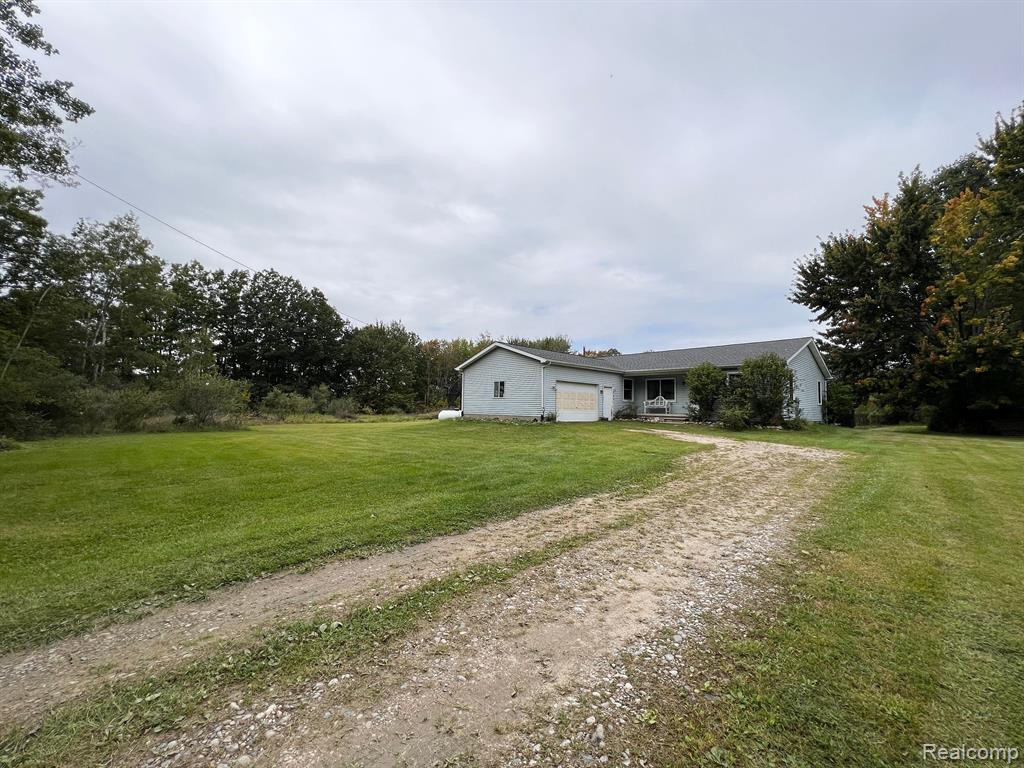 9860 OATMAN Road, Greenwood, MI 48006 — front exterior