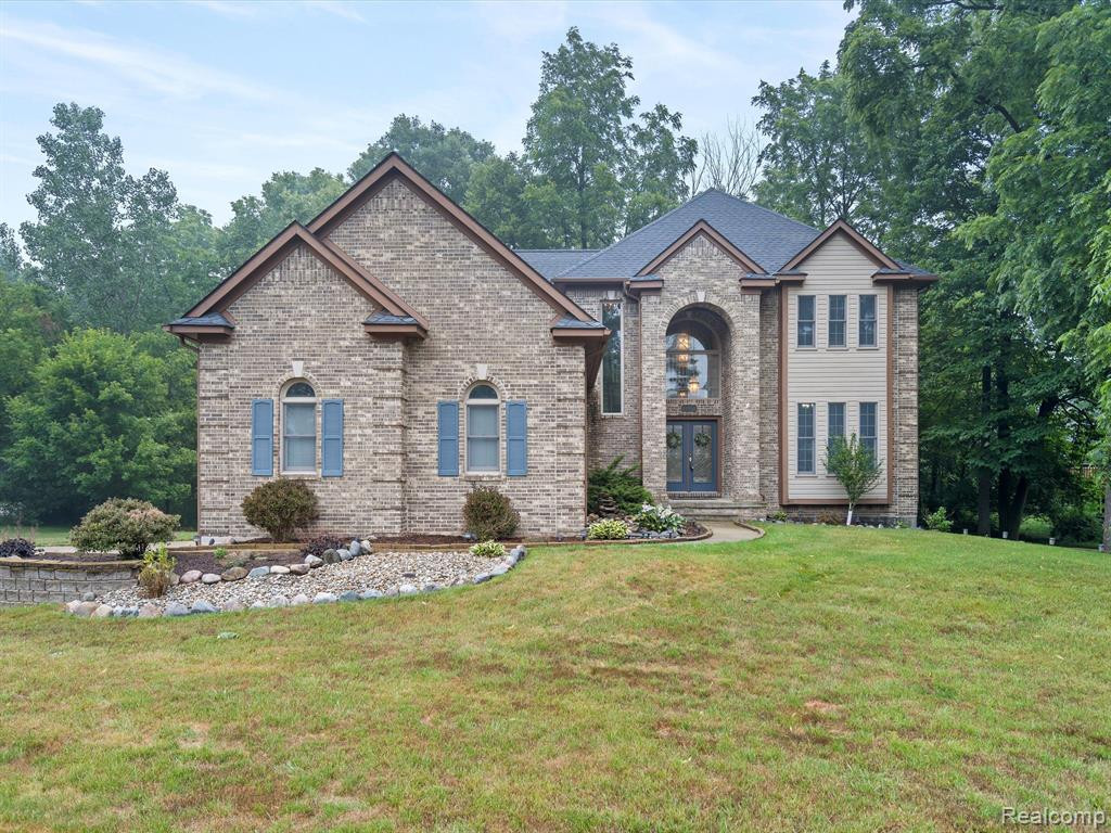 8327 WOODLAND Circle, Goodrich Vlg, MI — front exterior