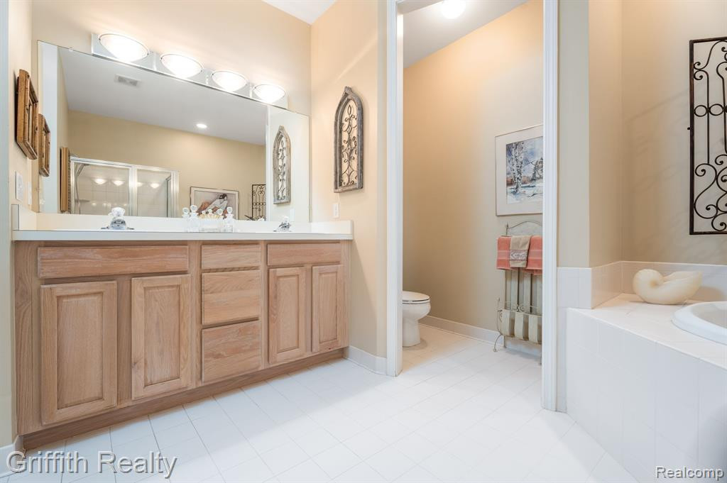 7563 WOODWIND Court, Brighton, MI 48116 — Photo 20