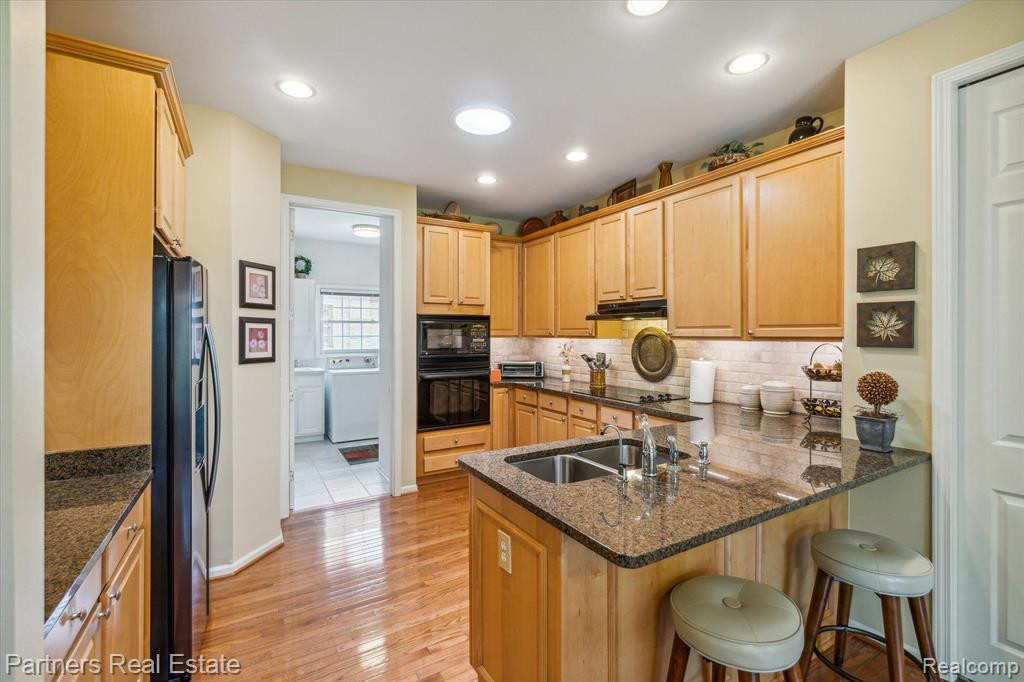 7570 WOODWIND Court, Brighton, MI 48116 — Photo 17