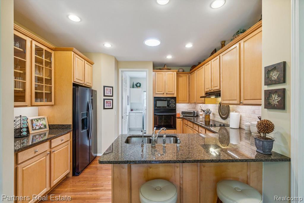 7570 WOODWIND Court, Brighton, MI 48116 — Photo 18