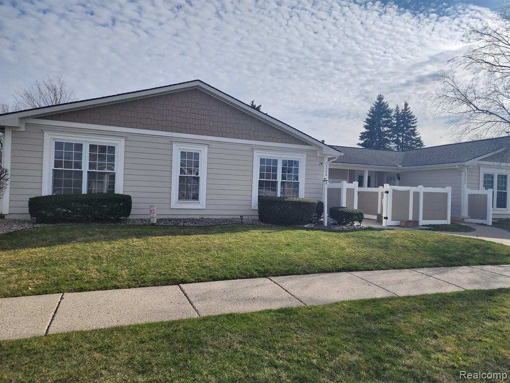 39774 VILLAGE WOOD Circle, 133, Novi, MI — front exterior