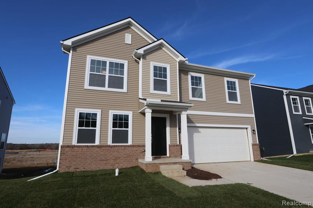 618 COUNTRYSIDE Drive, Chelsea, MI 48118 — front exterior