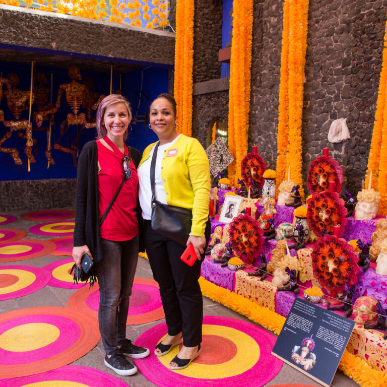 Students of the Fluenz Spanish Immersion in Mexico City inside La Casa Azul, the iconic Frida Kahlo Museum, experiencing cultural immersion while deepening their Spanish learning in this historic setting.