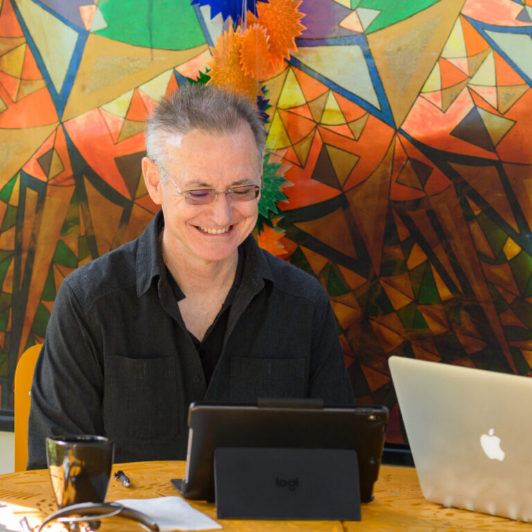 Adult learner in a one-on-one Spanish class on Zoom during the Fluenz Live Online program, part of an intensive Spanish immersion system with live online coaching, software, and assignments for adult learners.