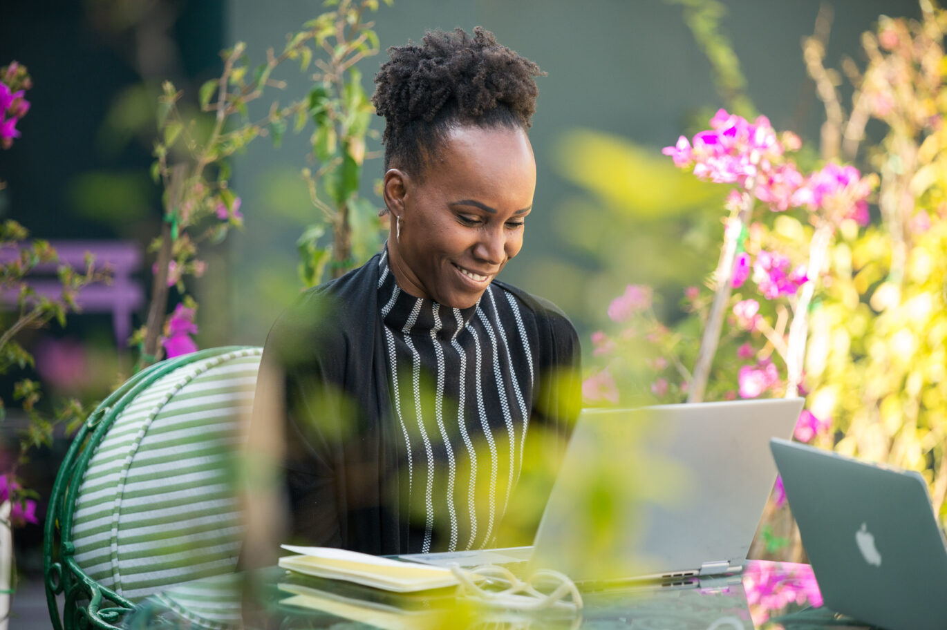 Professional woman engaged in a personalized Fluenz Live Online Spanish class via Zoom, practicing language skills in a supportive one-on-one coaching session.