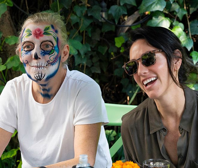 Student and Sonia Gil, Fluenz co-founder, sharing a cultural immersion activity during the Fluenz Spanish Immersion in Mexico City, where language learning is combined with authentic Mexican traditions.