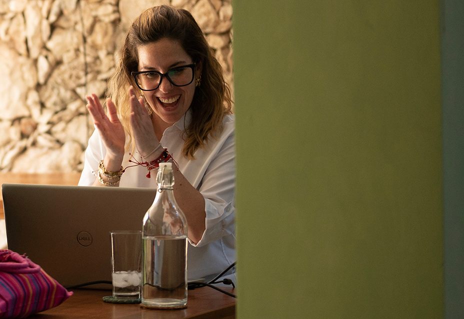 A Spanish tutor during a live session of the Fluenz Online Spanish Immersion program, guiding an adult learner through personalized one-on-one language coaching.